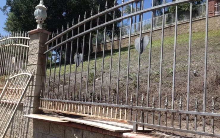 Rusted metal railing before sandblasting restoration