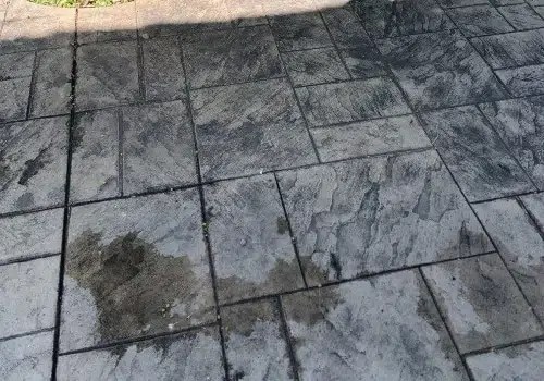 Stamped concrete surface being cleaned